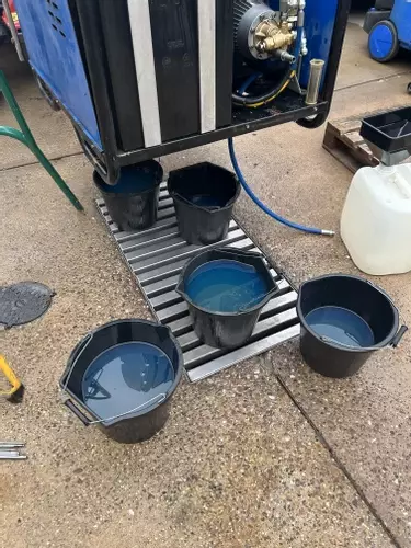 Fuel tank being drained and cleaned during industrial diesel hot pressure washer repair in Dover.